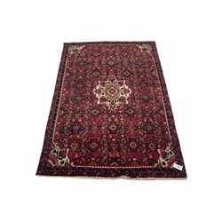 Persian red ground rug, all over patterned field