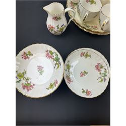 Coalport part tea service, decorated with floral sprigs, including eight cups and saucers, milk jug, eight dessert plates etc  