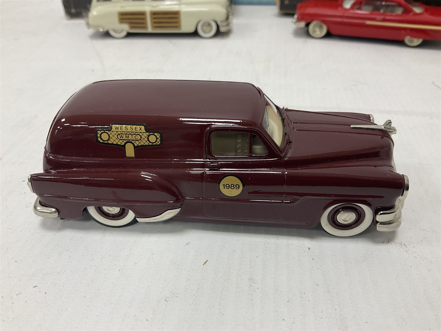 Brooklin Models - three 1:43 scale heavy die-cast model cars comprising BRK31 WMTC 1953 Pontiac Sedan Delivery in maroon with tan interior; BRK43 1948 Packard Station Sedan; BRK44 1961 Chevrolet Impala Sport Coupe; all boxed (3) 