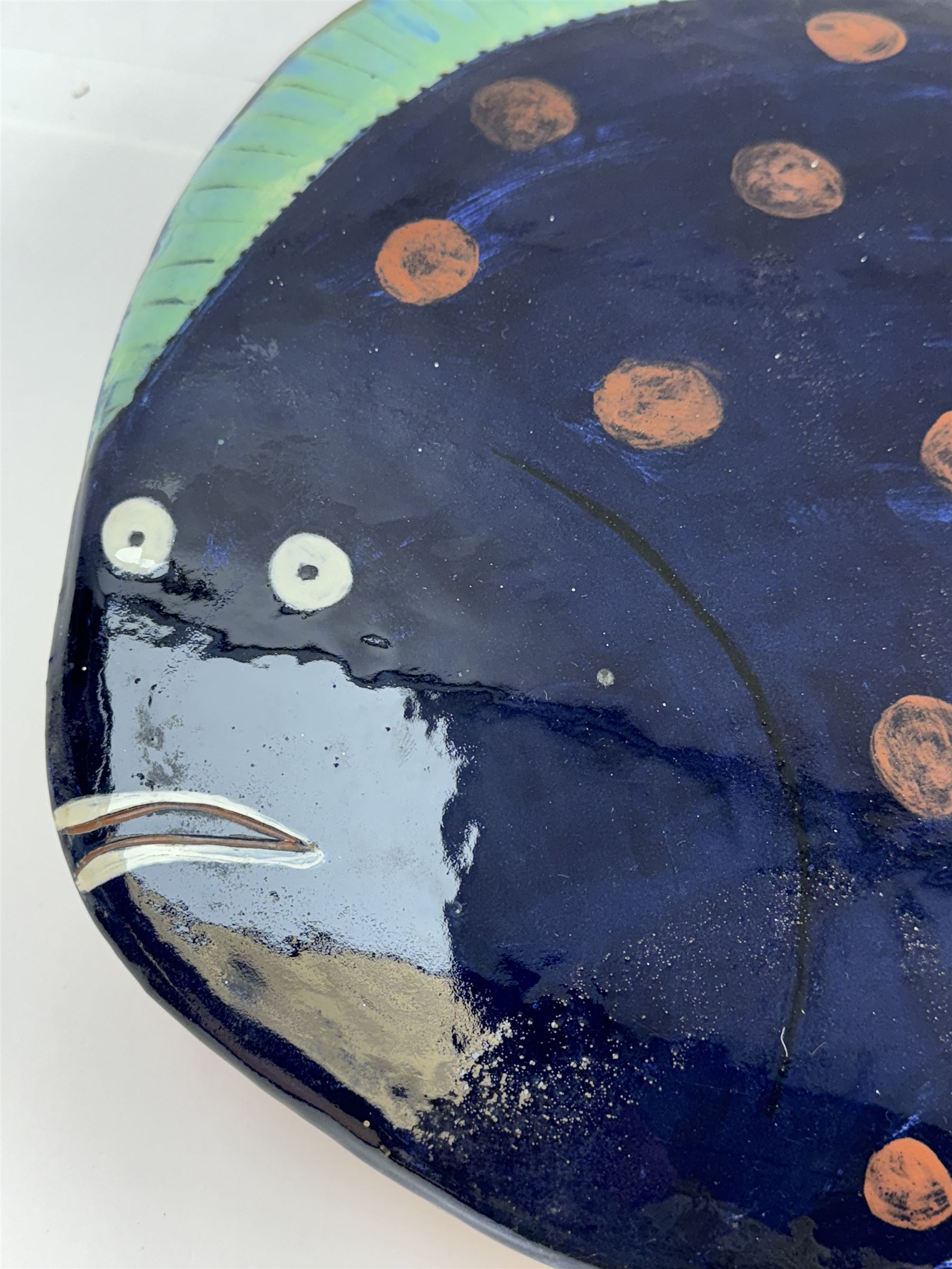 Studio pottery terracotta paella dish, modelled as a fish and finished in blue, green and brown glaze,  by Mary Hick Ceramics, Edinburgh, W44cm