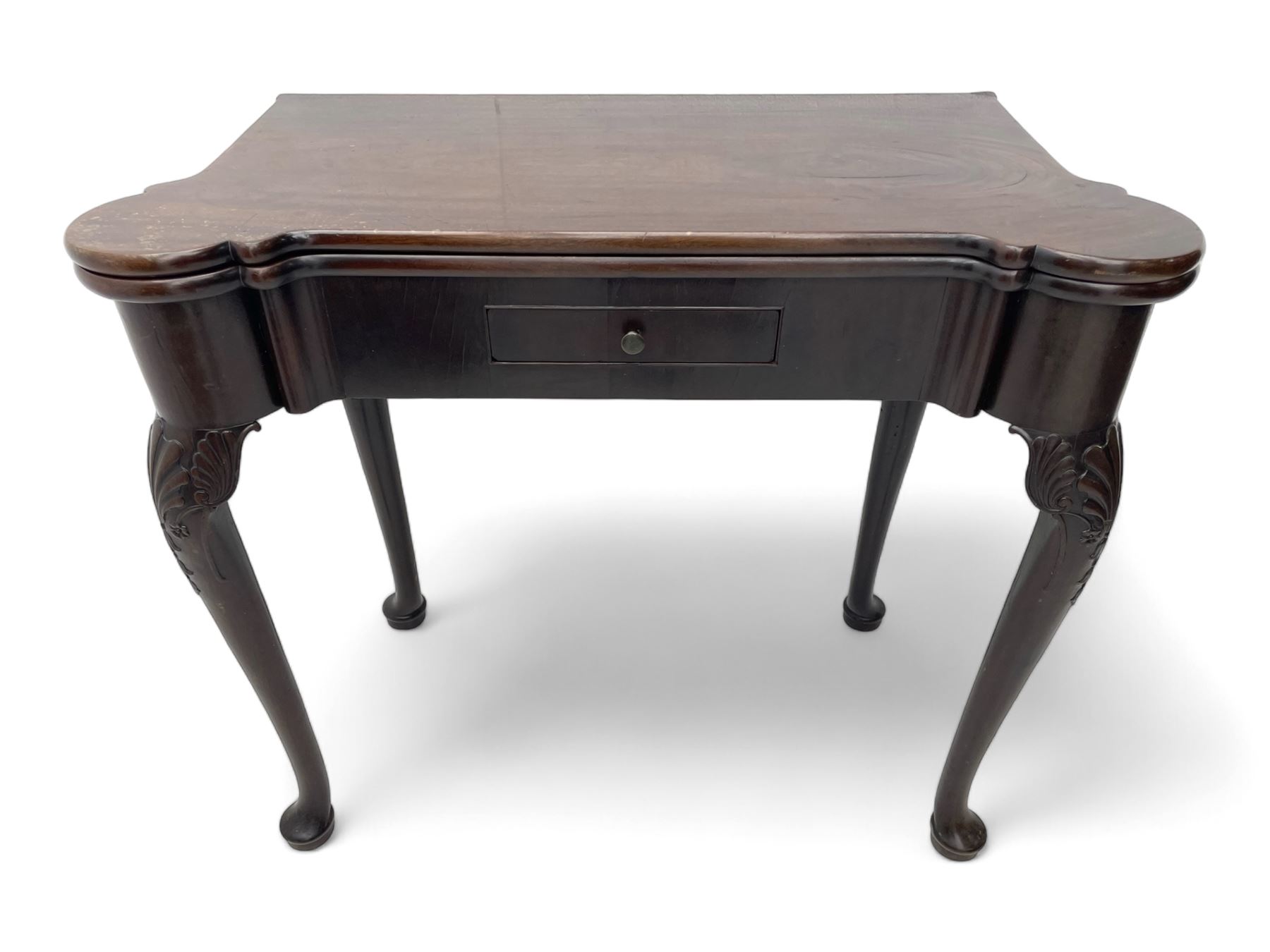 Late 18th century Irish mahogany tea table, rectangular form with projecting stepped rounded corners, fold-over action top over single frieze drawer within cock-beaded surround, on shell and bellflower carved cabriole supports, single gate-leg action base 