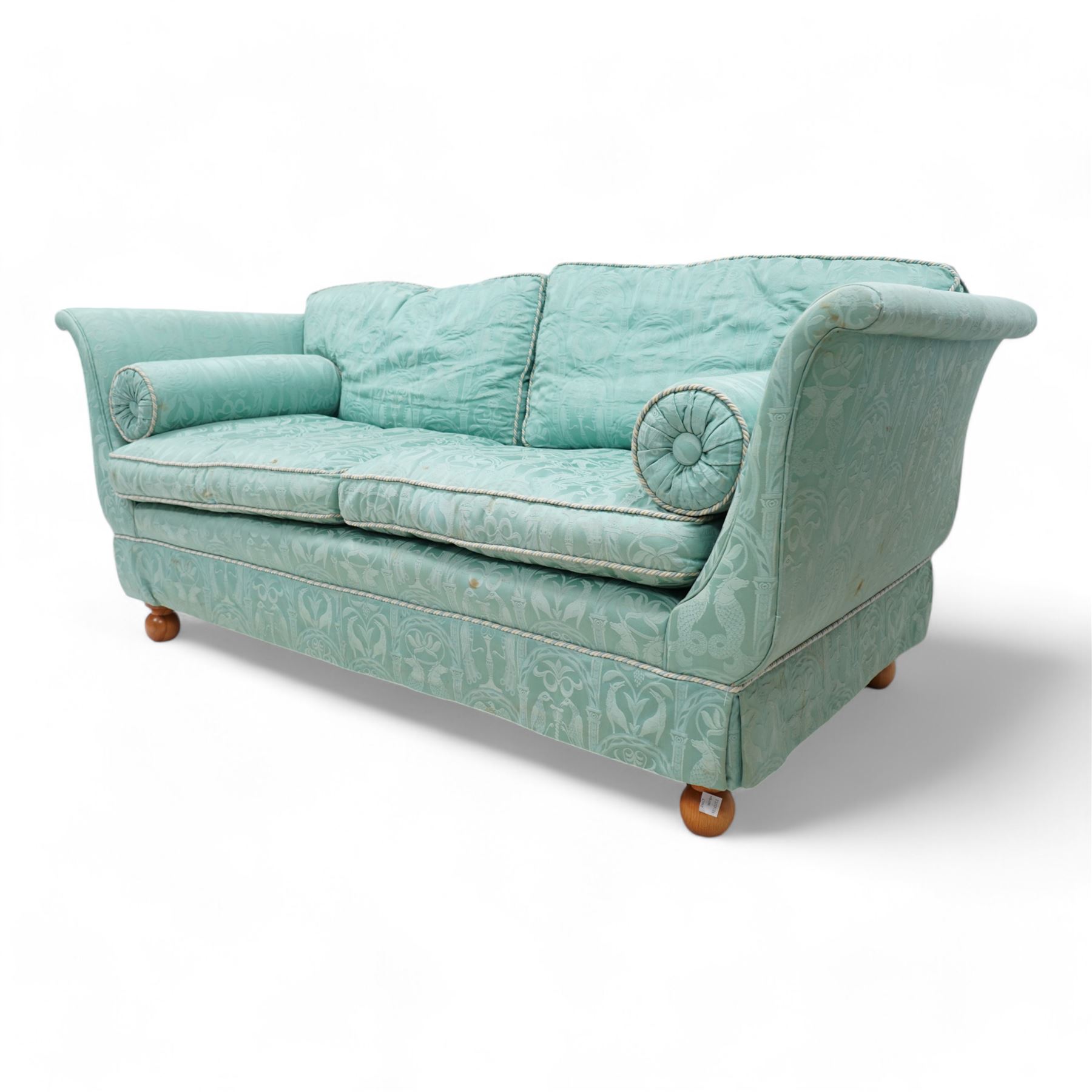 Regency shaped hardwood-framed two-seat sofa, upholstered in turquoise fabric decorated with arches enclosing birds of paradise and seahorses, on turned bun feet 