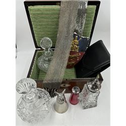 Two cut glass decanters, together with a faceted red glass bottle, cut glass sugar caster with pierced star cover, silver plated stirrup cup, chainmail scarf, plaster ships plaque and a walnut box with mother of pearl cartouche