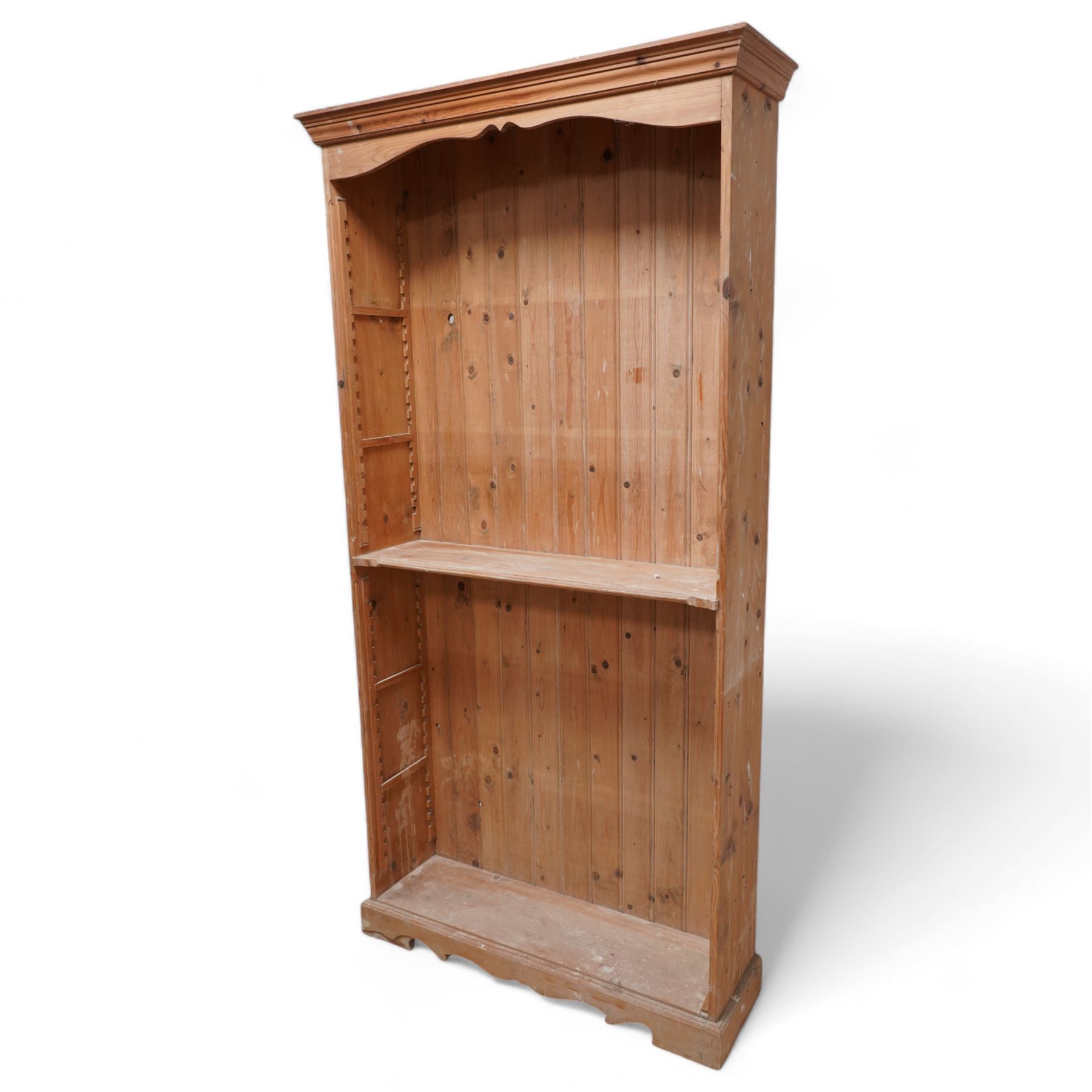 20th century rustic pine tall open bookcase, projecting cornice over shaped frieze