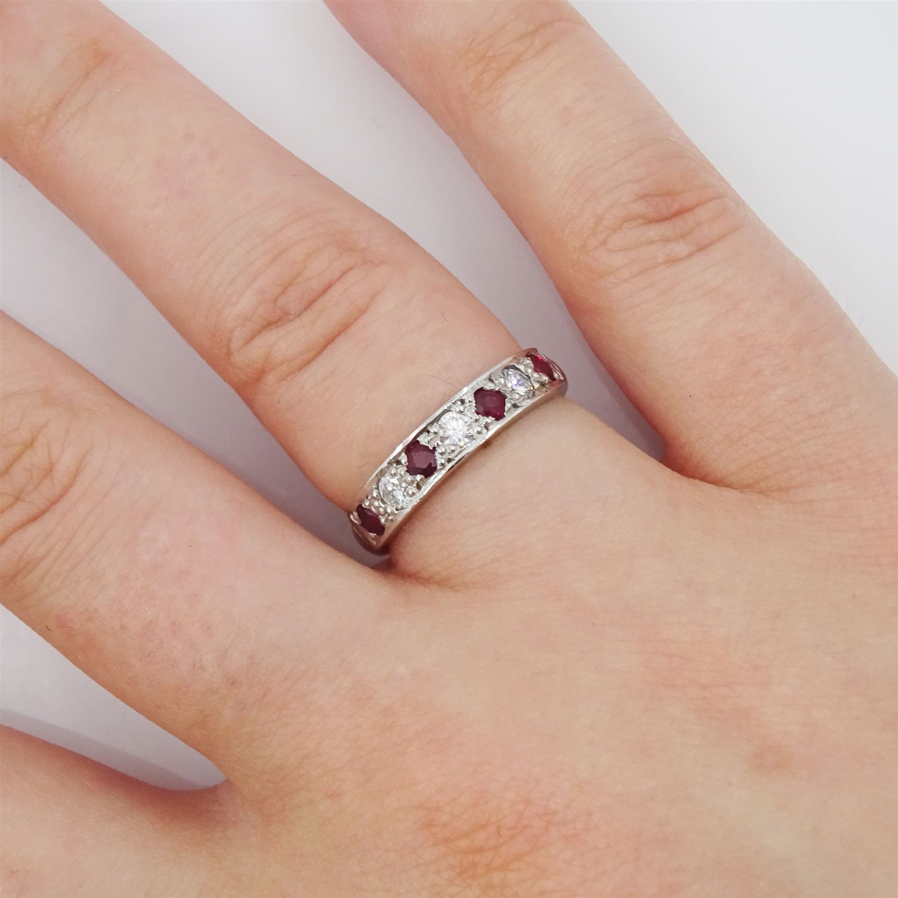 18ct white gold seven stone round brilliant cut diamond and ruby half eternity ring, Sheffield 1994, total diamond weight approx 0.20 carat