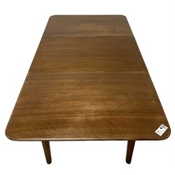 Mid-20th century teak extending dining table, rectangular top with rounded corners, raised on shaped tapering supports united by X-stretcher, with additional leaf