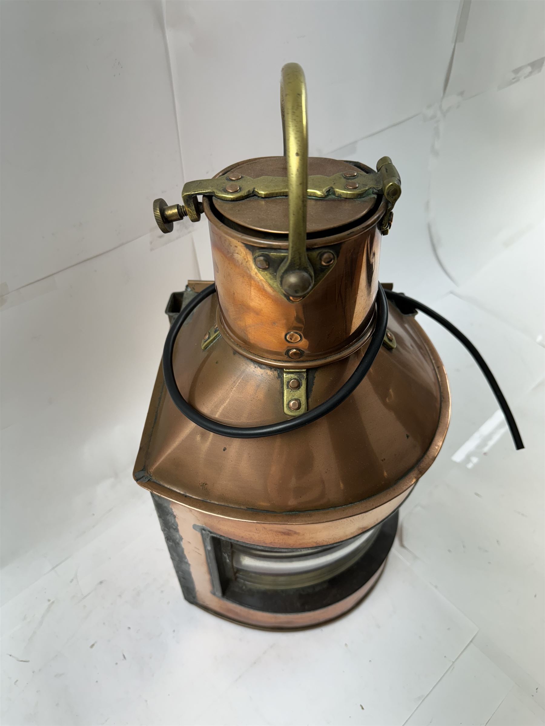 1940s copper and brass ship's corner lamp, converted to electricity, with applied plaque inscribed bow starboard patt.24, dated 1944, including handle H46cm 