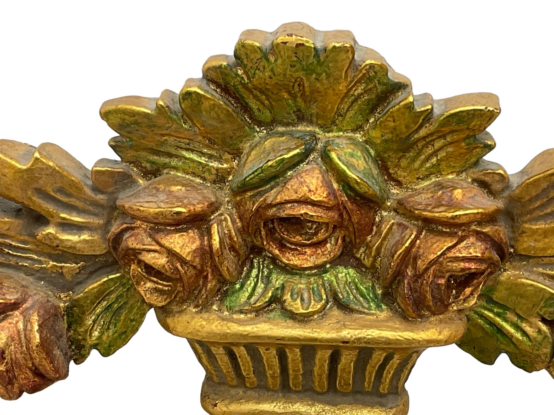 Spanish style wood and composite wall mirror, flower head pediment over plain mirror plate, foliate moulded frame