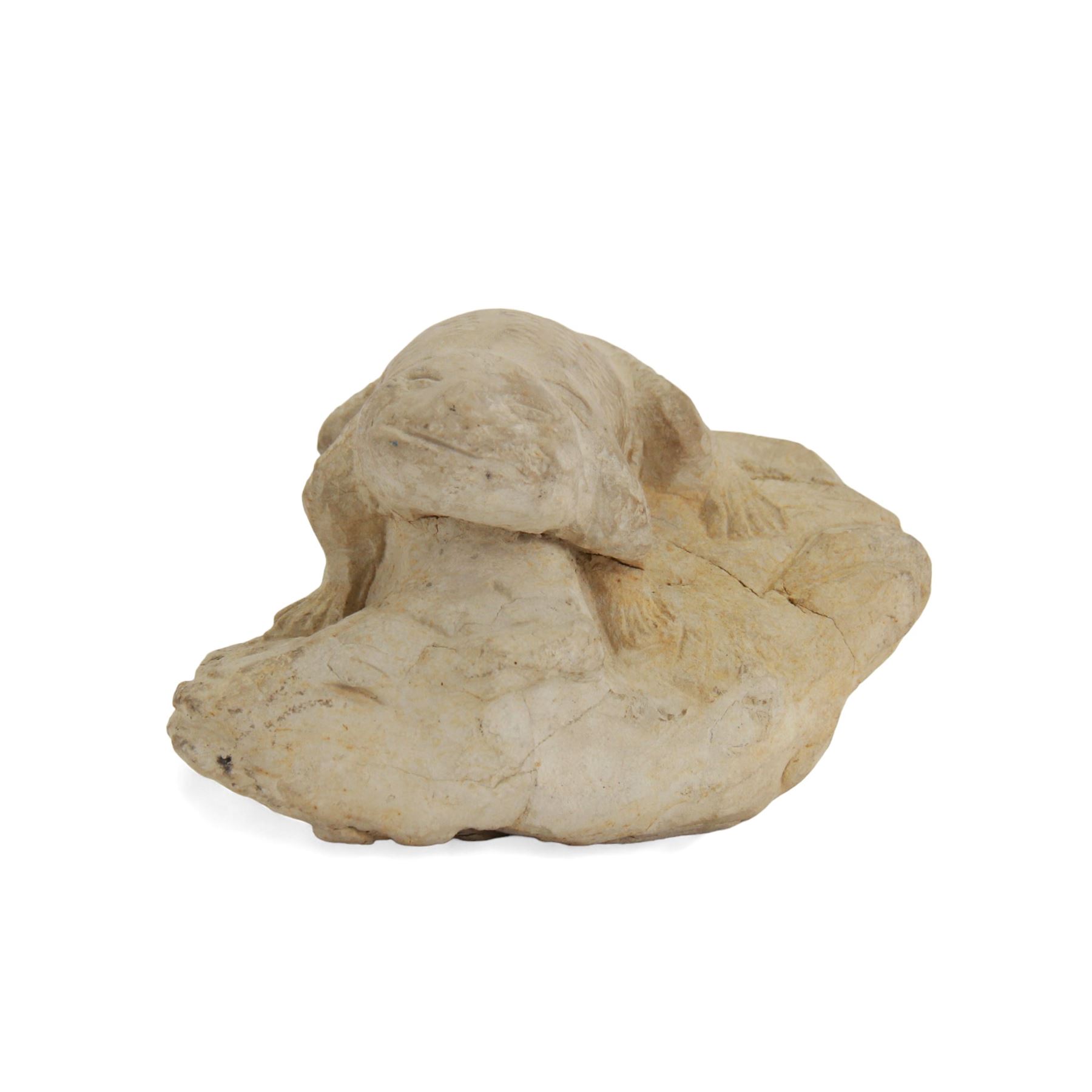 Pre-Columbian figure, probably limestone, carved as a lizard or frog upon a naturalistic base, H12cm