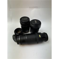 Three Canon EF camera lenses, comprising 100-300mm 1:5.6 lens serial no. 1057918, 50mm 1-1.8 lens serial no. 1153183 and a 55-200mm 1:4.5-5.6 USM zoom lens serial no. 2100282B, together with a Canon EF-S 18-135mm 1:3.5-5.6 image stabiliser lens serial no. 7242517341