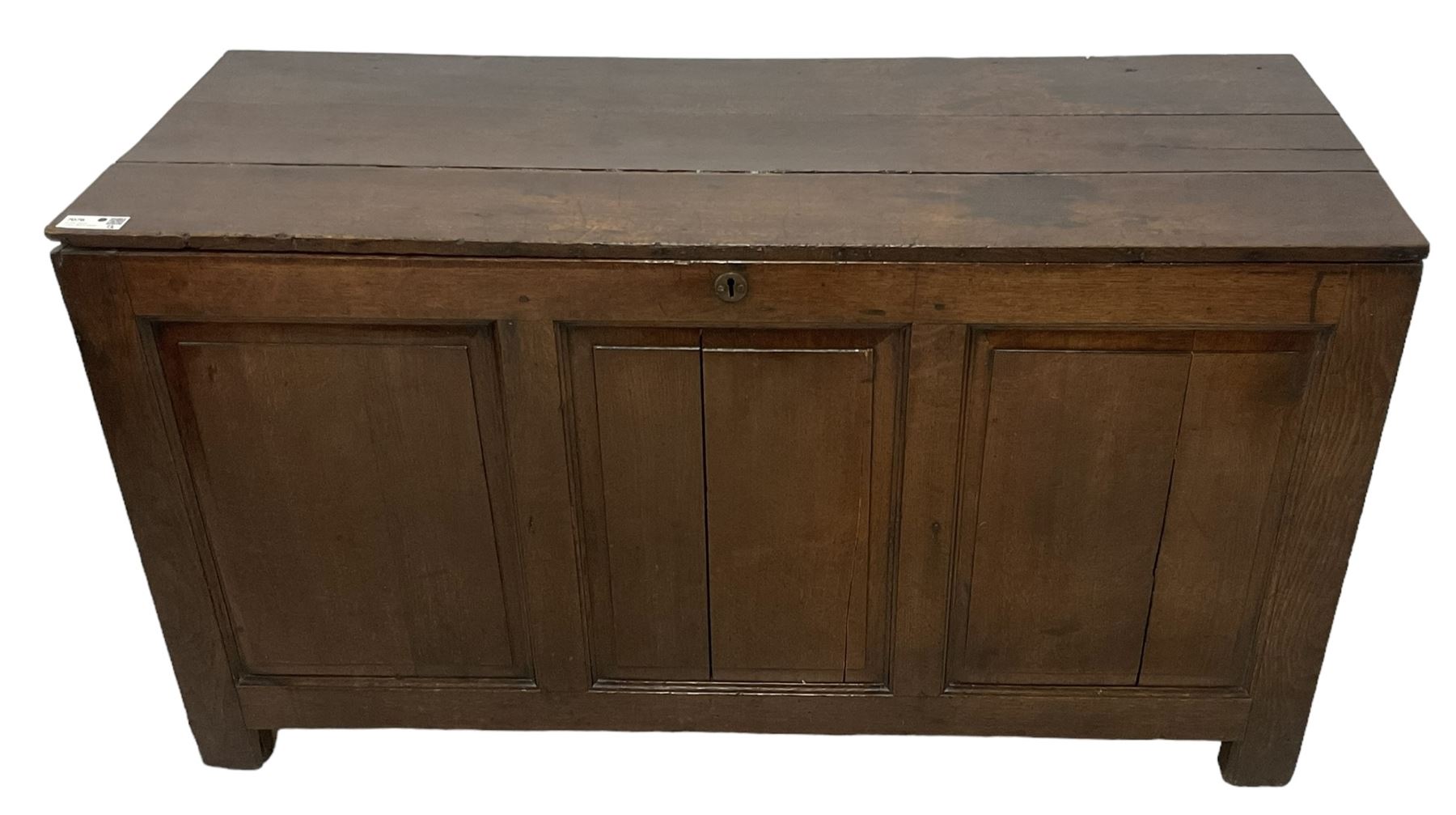 Large 18th century oak coffer or blanket box, hinged lid over triple panelled front, panelled back and sides, on stile supports 