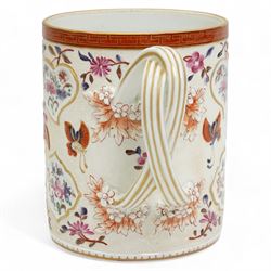 Large porcelain tankard by Samson of Paris, decorated in the Chinese Export famille rose style with panels of flowers, against a low relief ground of butterflies and floral sprigs, with reeded strapwork handle, H15cm