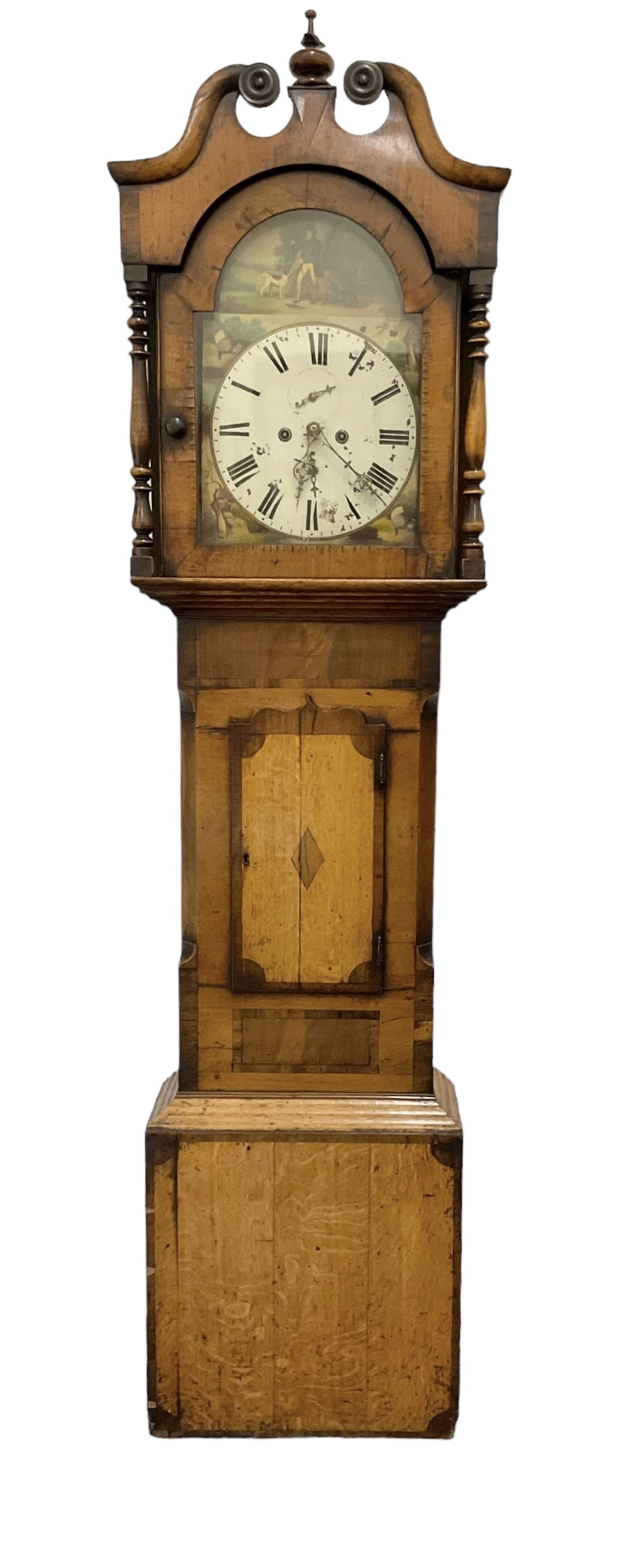 Late 19th century - oak and mahogany 8-day longcase clock, with a swan necked pediment, break arch hood door beneath flanked by ring turned pilasters, trunk with canted corners and a short wavy topped door, on a reduced plinth with no feet, painted dial with a depiction of a huntsman to the arch and game to the spandrels, with brass hands, Roman numerals and matching seconds and date dials, dial pinned directly to a rack striking movement, striking the hours on a bell. With pendulum and two weighs 