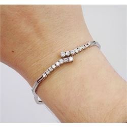 18ct white gold round brilliant cut diamond crossover bracelet, stamped 750, total diamond weight approx 0.80 carat