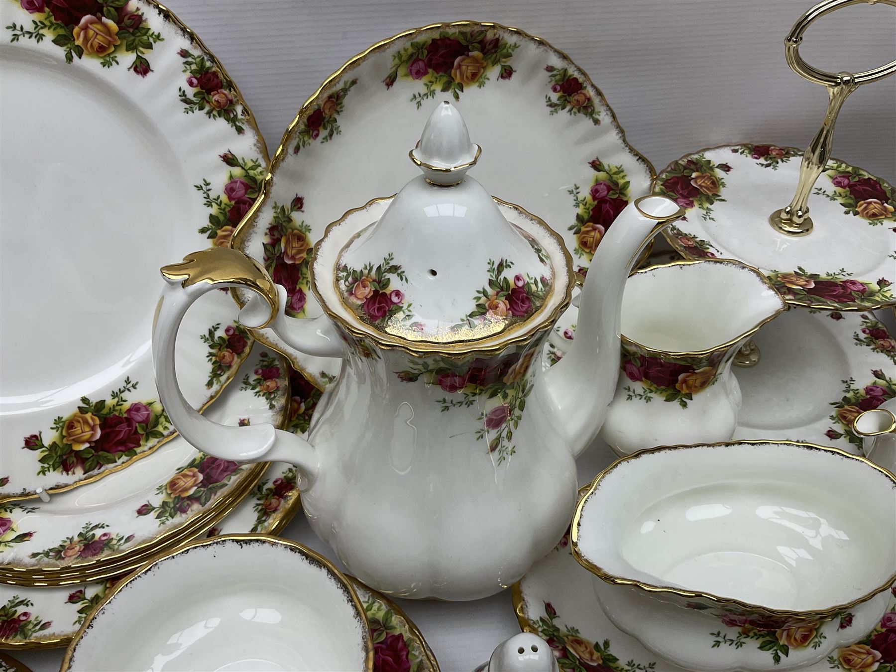 Royal Albert Old Country Roses pattern coffee service for six, comprising coffee pot, milk jug, cups and saucers, cake plate, together with miniature teapot, six teacups and saucers, six dinner plates, six side plates etc 