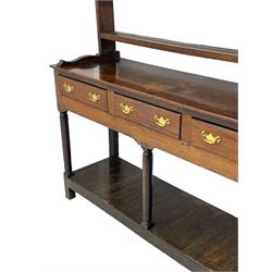 18th century oak dresser, raised three tier plate rack with moulded cresting rail, rectangular top over three drawers, the drawer fronts with moulded edges, turned supports united by pot board base 