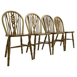 Set of four elm and beech wheelback dining chairs