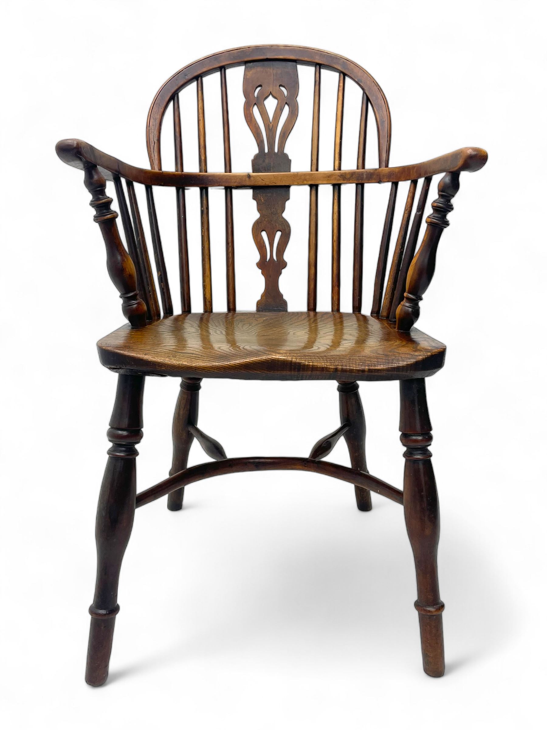 19th century yew wood and elm Windsor armchair, low double hoop stick and pierced splat back, dished seat on turned supports united by crinoline stretchers