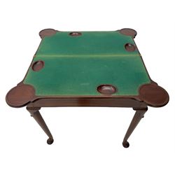 George III mahogany games table, the rectangular fold-over top with extending stepped rounded corners, opening to reveal baize lined interior with sunken counter wells, concertina action base, on lappet cabriole supports