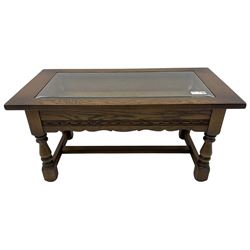 Old Charm - oak coffee table, rectangular top with glass inset over carved scalloped apron, on turned square supports connected by H-stretcher