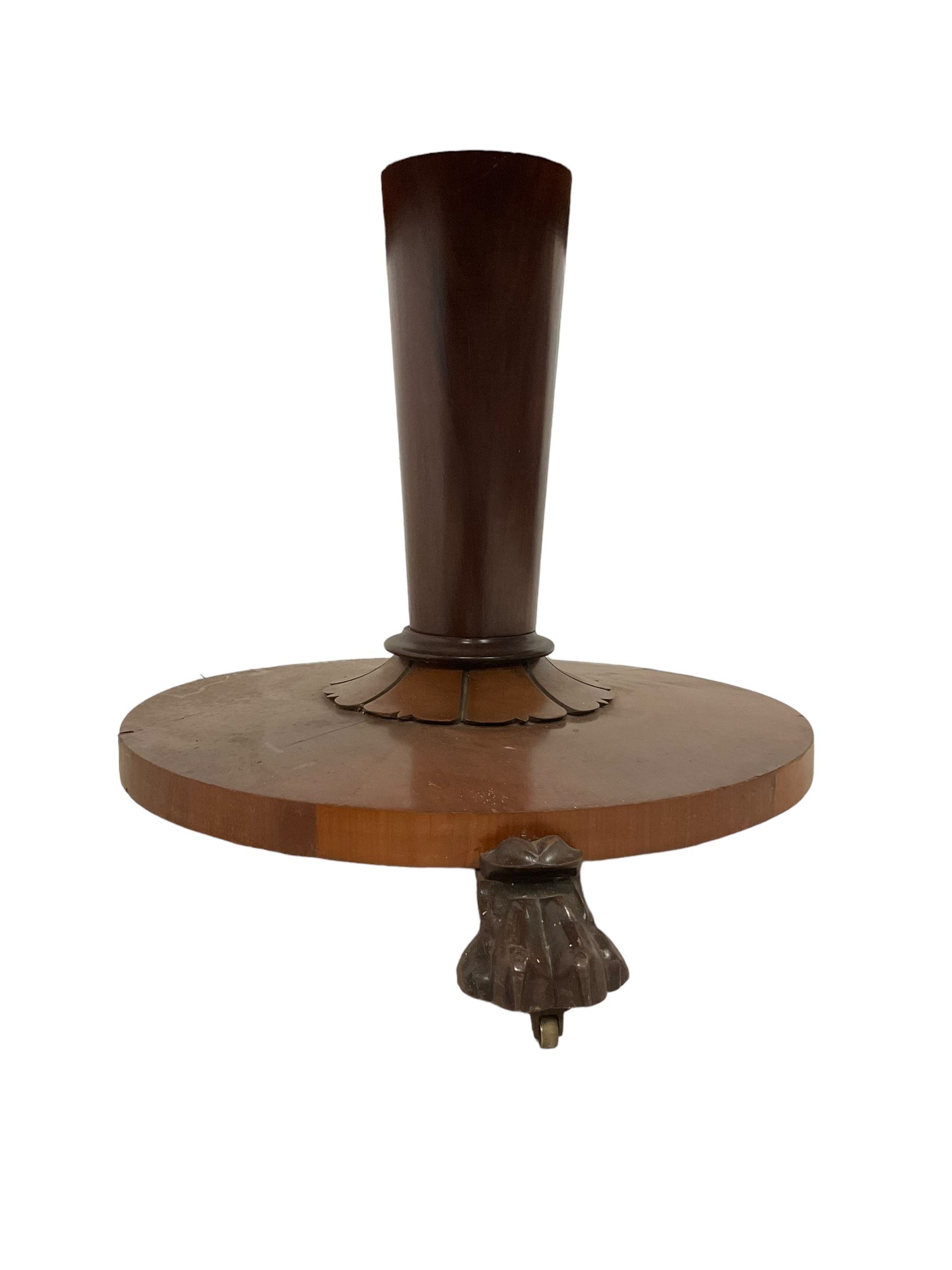 Victorian mahogany breakfast table, circular top with moulded edge, on a tapering pedestal with shaped collar on circular base, raised on three large paw feet