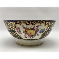 19th century continental bowl, decorated with hand painted floral sprays amongst gilt foliate decoration on a cobalt blue ground, D27.5cm