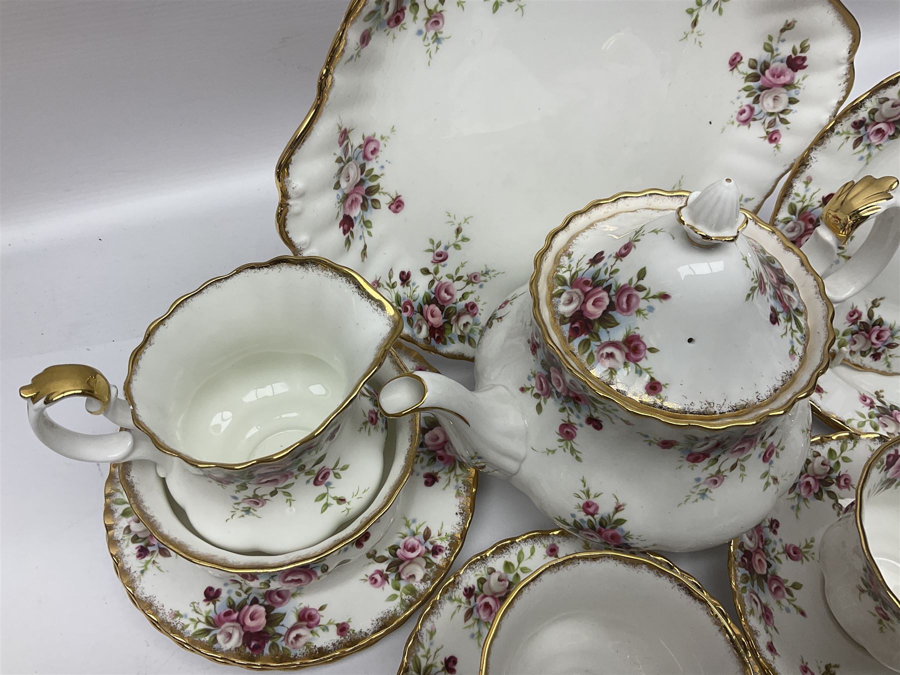 Royal Albert Cottage Garden pattern tea service for six people, comprising teapot, milk jug, sugar bowl, teacups and saucers, side plates and cake plate, all with printed mark beneath