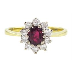 18ct gold oval cut ruby and round brilliant cut diamond cluster ring, London 1976, ruby ap...