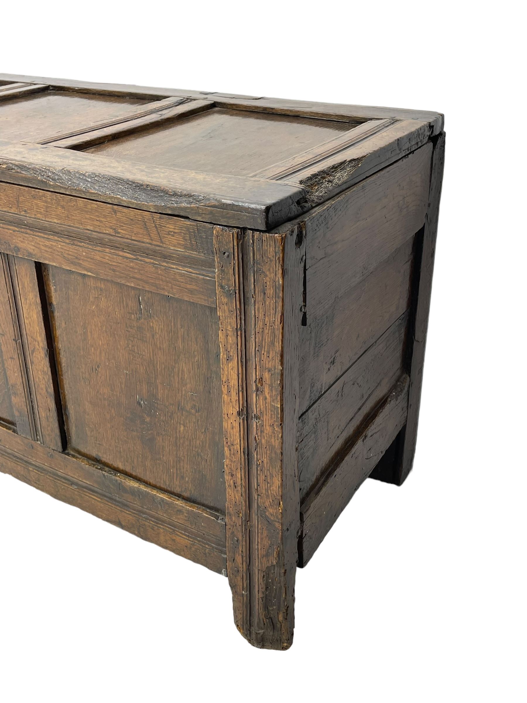 17th century panelled oak blanket chest or kist, quadruple panelled hinged lid over quadruple panelled front, moulded frame and pegged construction, on stile supports