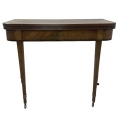 19th century mahogany tea table, fold-over top with reeded edge over inlaid frieze, on double gate-leg action square tapering supports, with brass castors