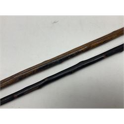 Two wooden walking sticks, both with comparts that would have housed horse measures, H88cm