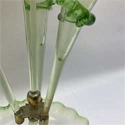 Victorian Vaseline glass epergne, the frilled circular bowl supporting a central frilled trumpet, flanked by three smaller trumpets, H58cm