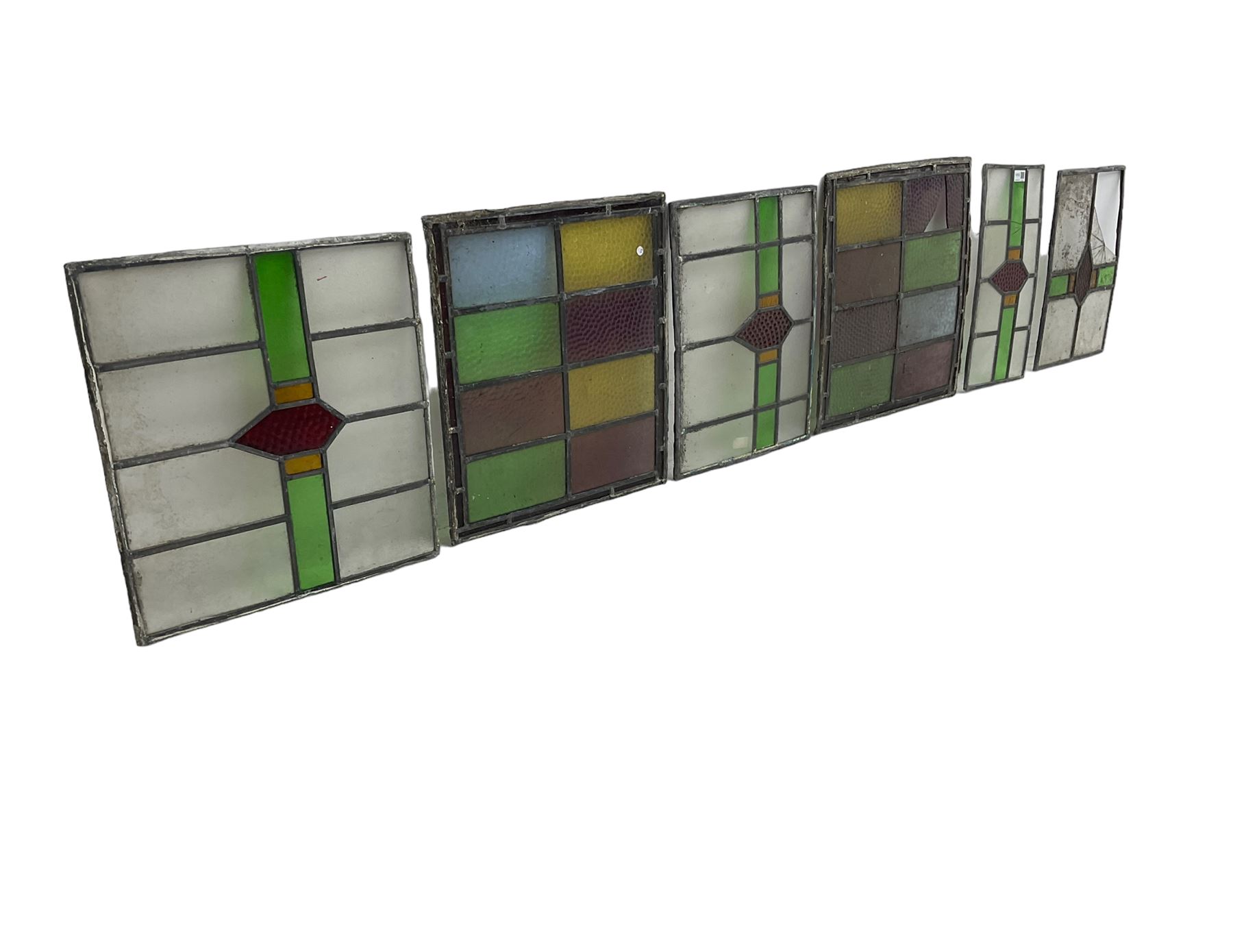 Six leaded stained glass window panes, largest measuring - 46cm x 41cm