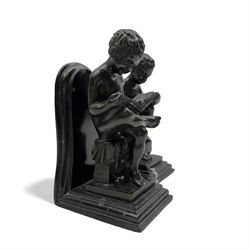 Pair of marble and bronzed bookends, modelled as putti reading, H22cm