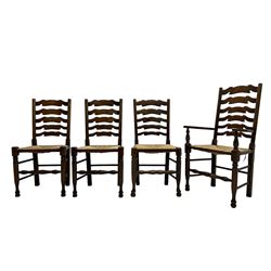 Matched set of eight (7+1) oak ladder back dining chairs, waved ladder back over rush seats, on turned supports joined by turned stretchers