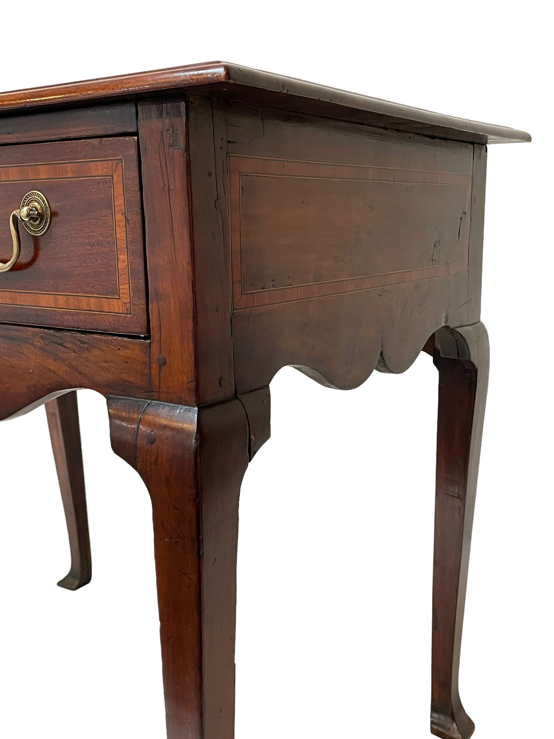 18th century and later inlaid mahogany and fruitwood low-boy, the moulded rectangular top with satinwood band, shaped frieze fitted with single drawer, on cabriole supports with angular feet