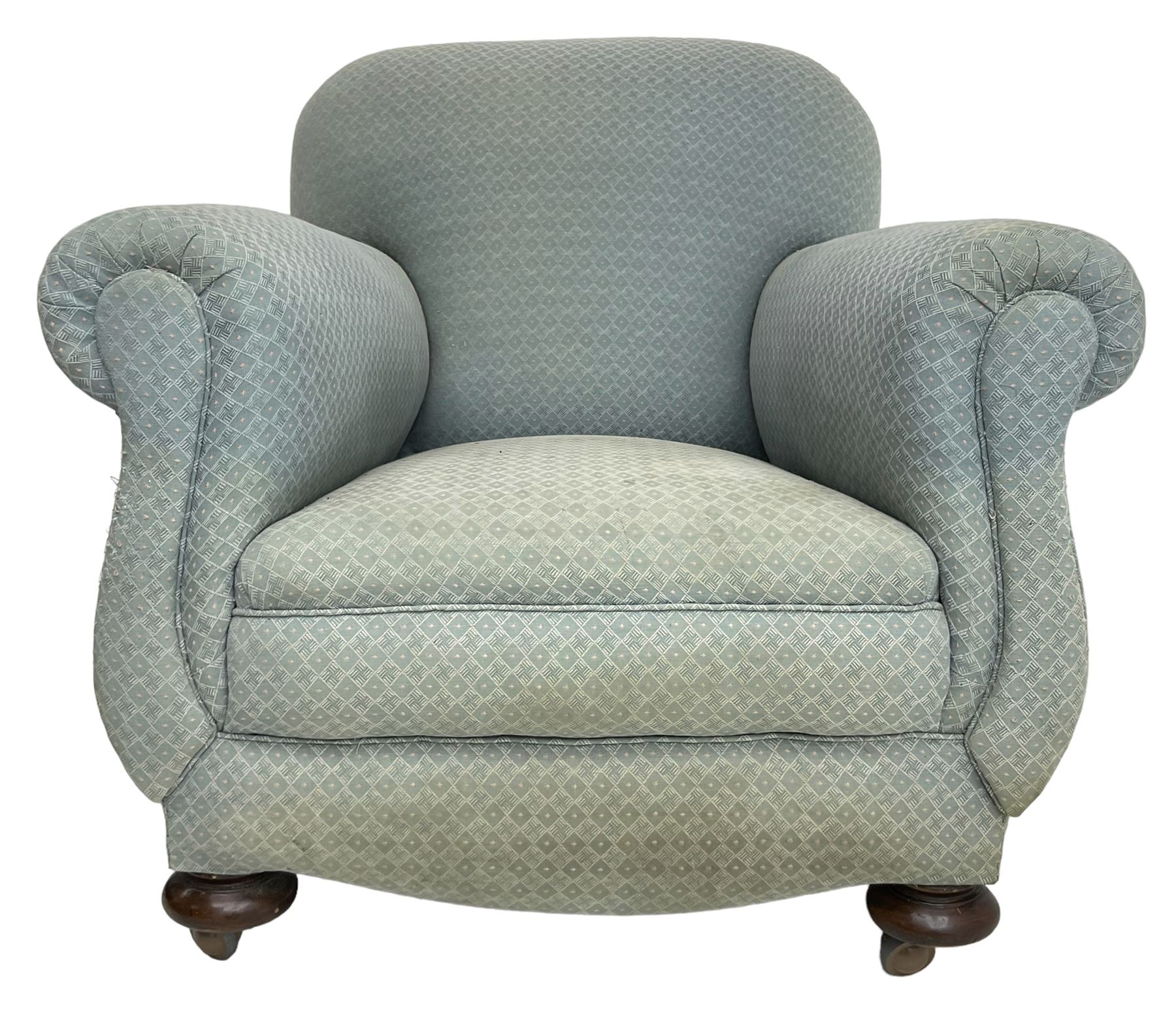 20th century traditional shape armchair, curved back and rolled arms, upholstered in light blue patterned fabric, on turned front feet