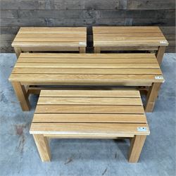 Three small light oak benches and a large bench