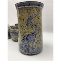 John Egerton (c1945-): studio pottery stoneware, comprising wine cooler decorated with herons on a mottled ground, covered storage jar with foliage decoration and a lamp base decorated with grape vines, wine cooler H23cm