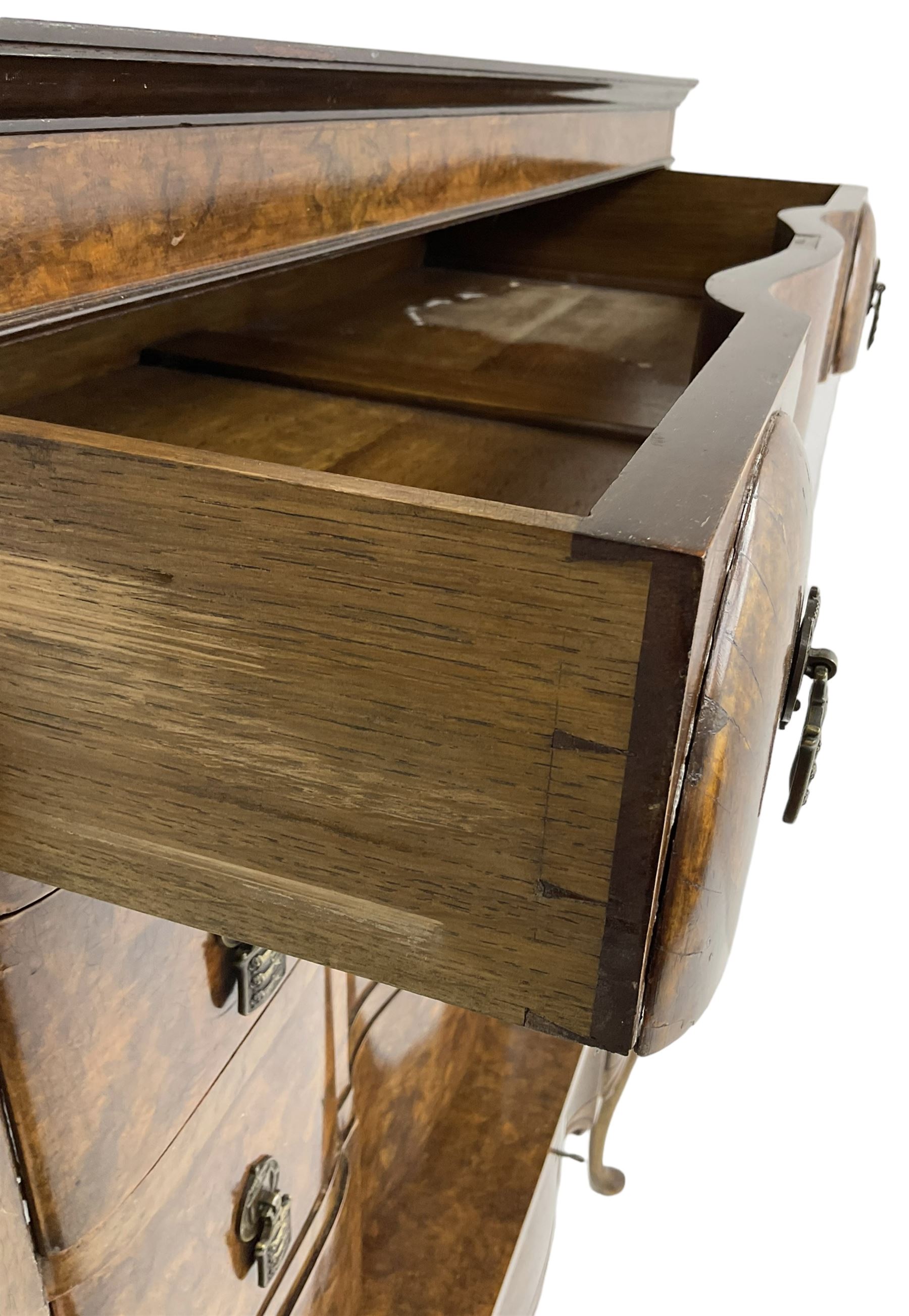 Early to mid-20th century figured walnut chest on stand, four graduating drawers on stand fitted with single drawer, drop handles in the form of shields with three recumbent lions, on cabriole supports