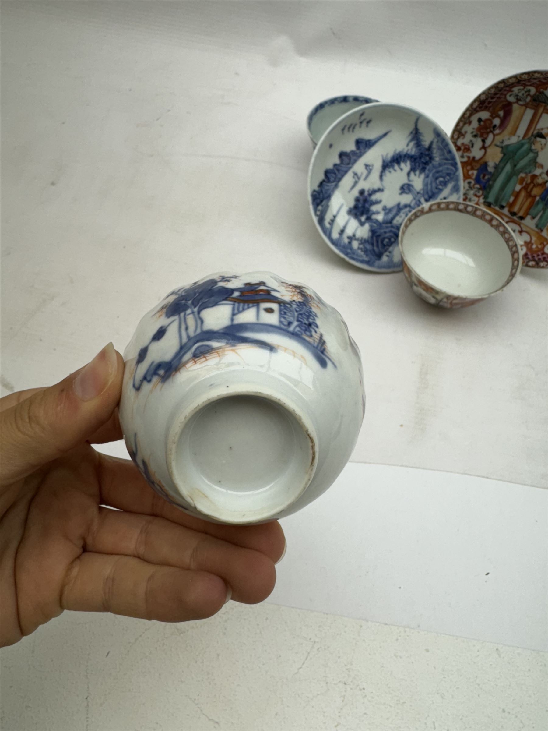 19th Century Chinese tea bowl and saucer, decorated with figures in a garden scene, together with tow other tea bowls and a saucer 