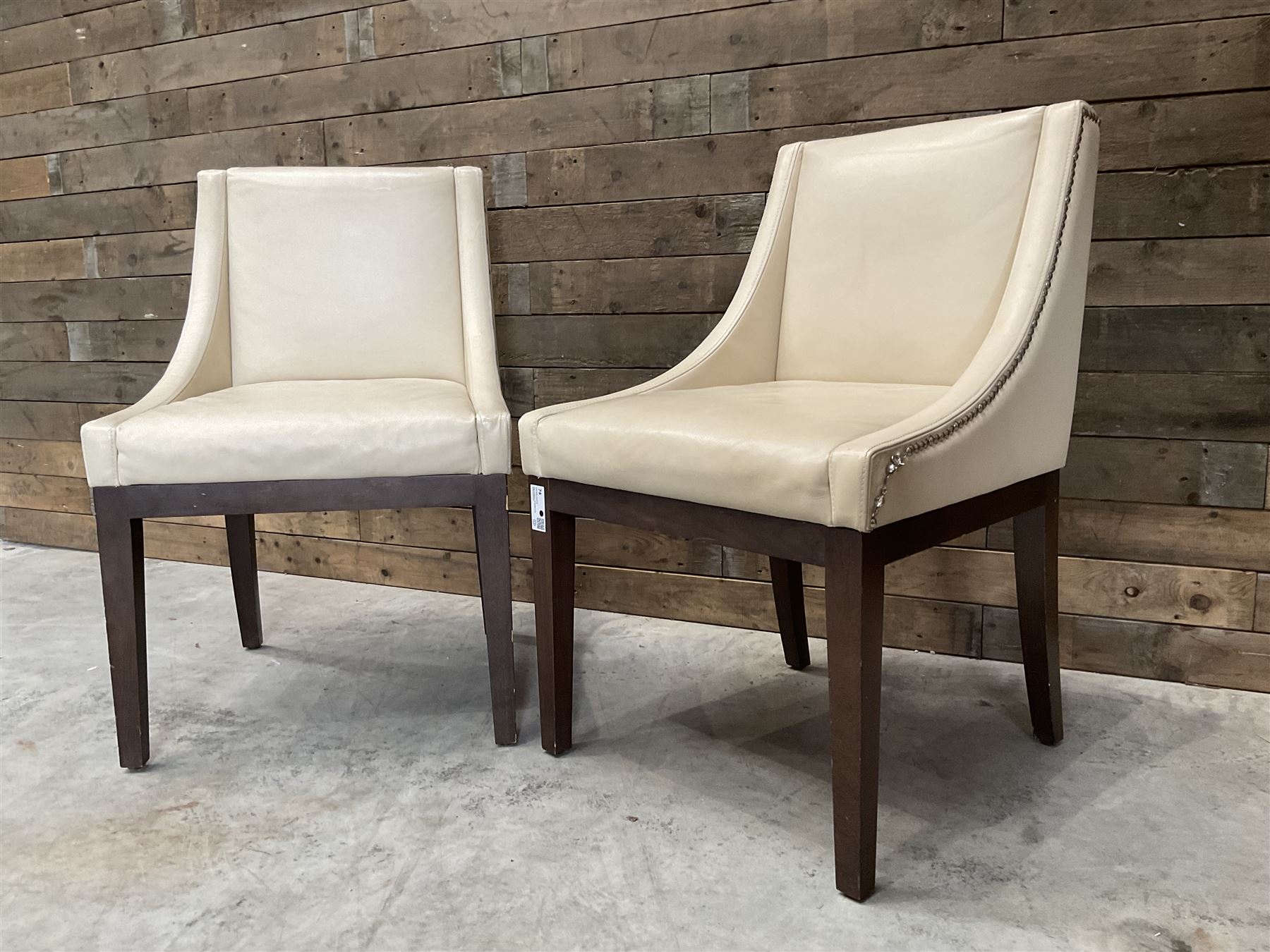 28 x walnut framed dining chairs, upholstered in beige leather