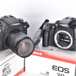 Canon EOS 30V SLR camera body serial no. (21)95000615, with a Canon EF 28-90mm 1:4-5.6 USM zoom lens serial, together with a Canon EOS 30 SLR camera body serial no. (21)71001811, both with original boxes and a Lowepro carry case