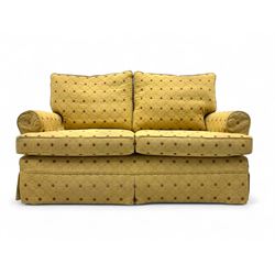 Two-seater upholstered sofa, loose cover in a pale gold quilted fabric with diamond patter...