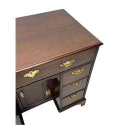 George III mahogany kneehole desk, moulded rectangular top over one long drawer, six short drawers and recessed panelled cupboard, cock-bead moulded frame, fitted with shaped brass handle plates with engraved decoration, on bracket feet 