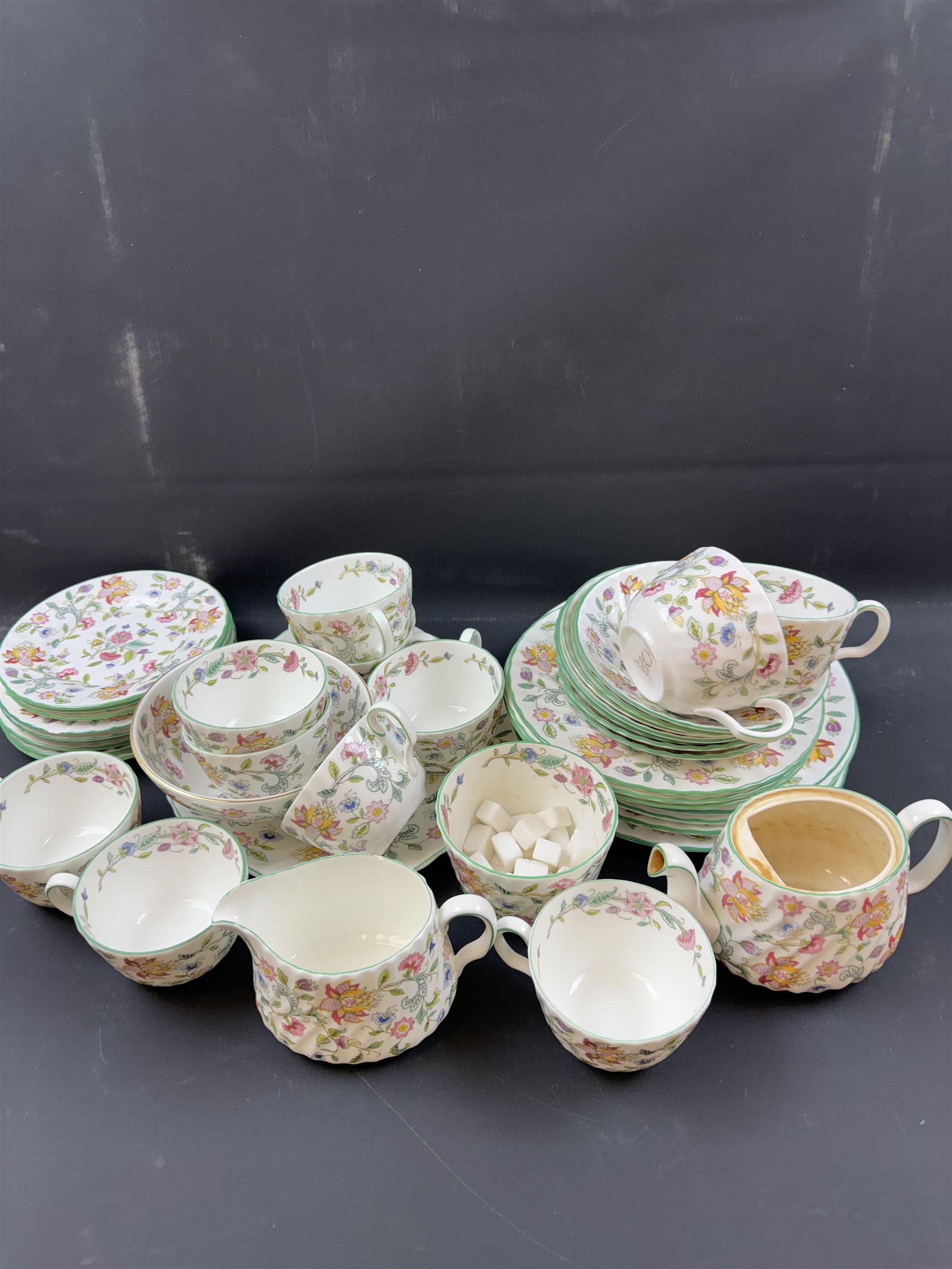 Minton Haddon Hall pattern part tea service, including milk jug, open sucrier, teacups and saucers, dessert plates etc