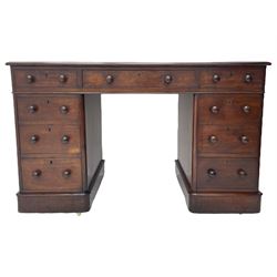 Victorian mahogany twin pedestal desk, moulded rectangular top with inset leather writing surface, nine drawers each fitted with two turned handles, on moulded plinth base 