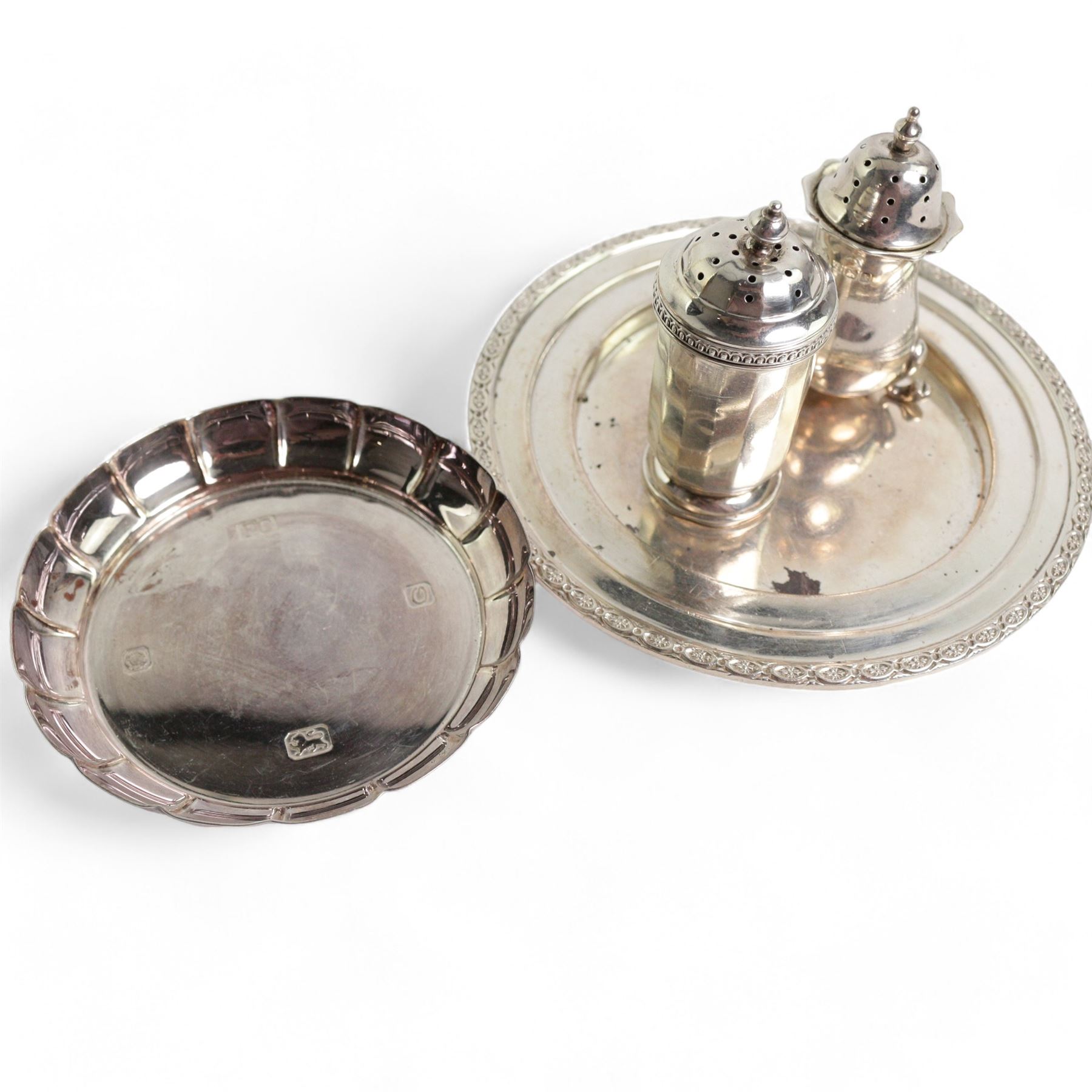 Late Victorian silver sugar bowl and matching cream jug with crimped rims Birmingham 1900, silver three piece condiment set, silver pepperette and two silver saucer dishes 