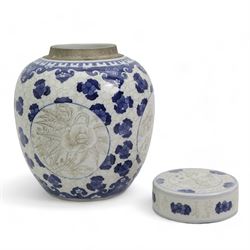 Chinese blue and white ginger jar, with sepia decoration, possibly unfinished, double ring mark beneath, H21cm, Chinese blue and white prunus pattern charger, D37.5cm, Japanese vase and a Chinese blue and white teapot, with associated cover and stand (4)