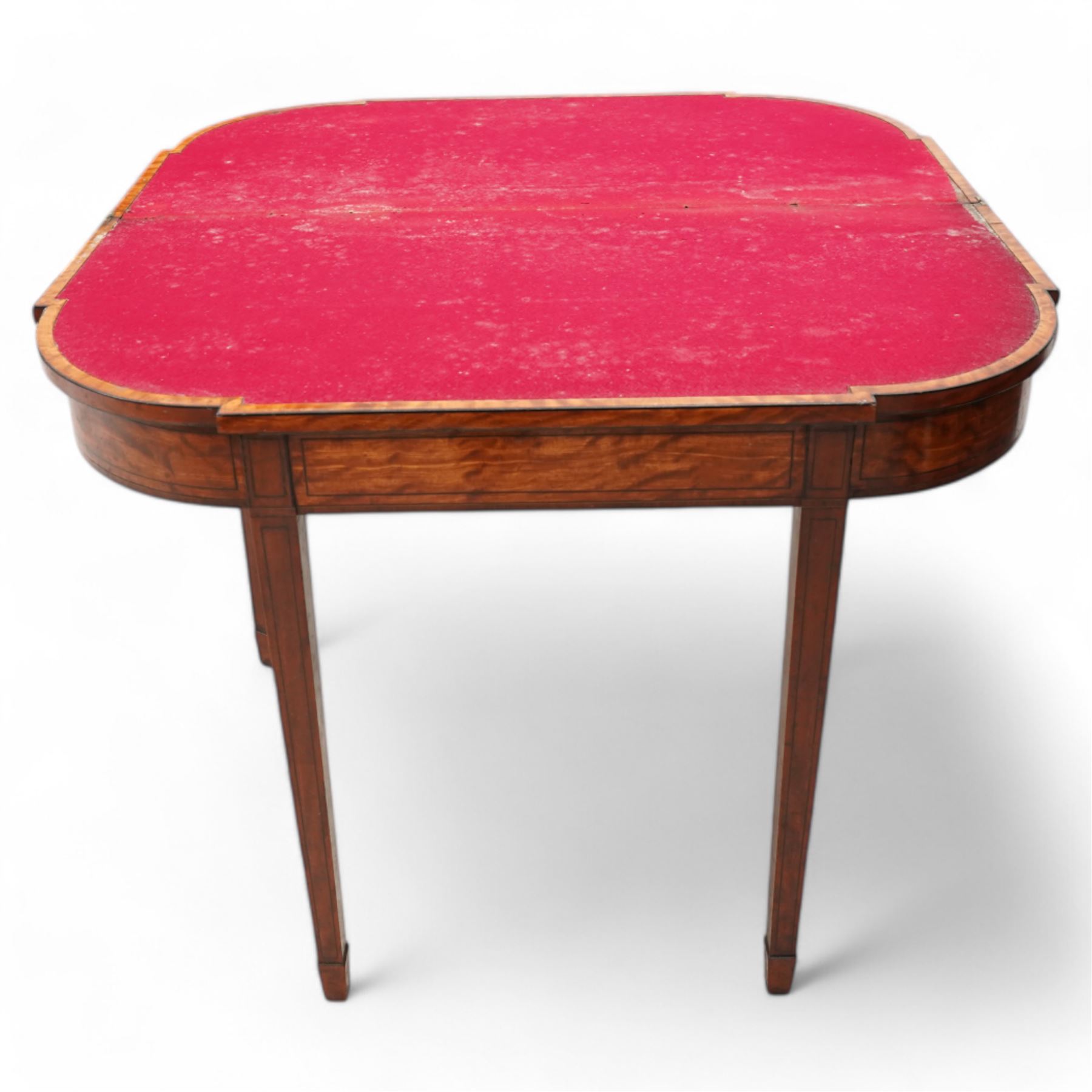 Sheraton period satinwood card table, stepped D-end form, fold-over top revealing baize playing surface, double gate-leg action base, on square tapering supports with peg feet 